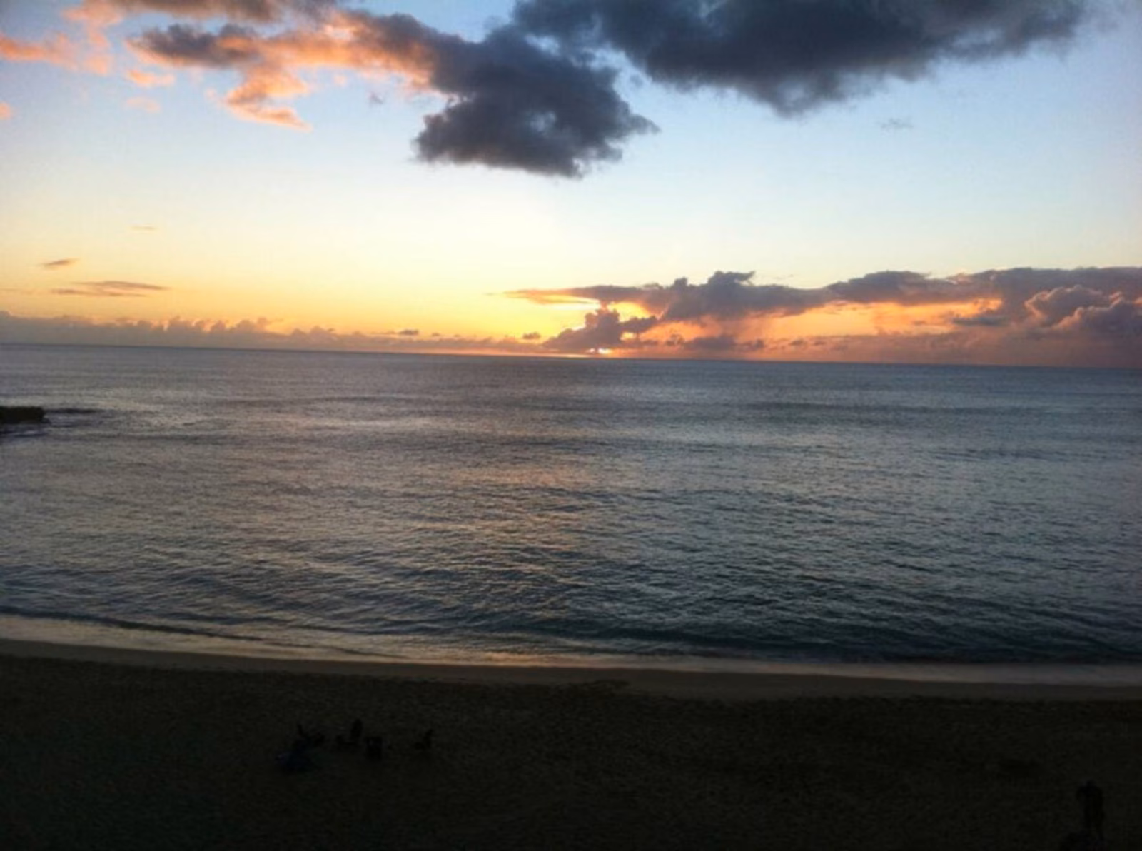 Sunset over the Pacific seen from the condo, with the ocean turning gold